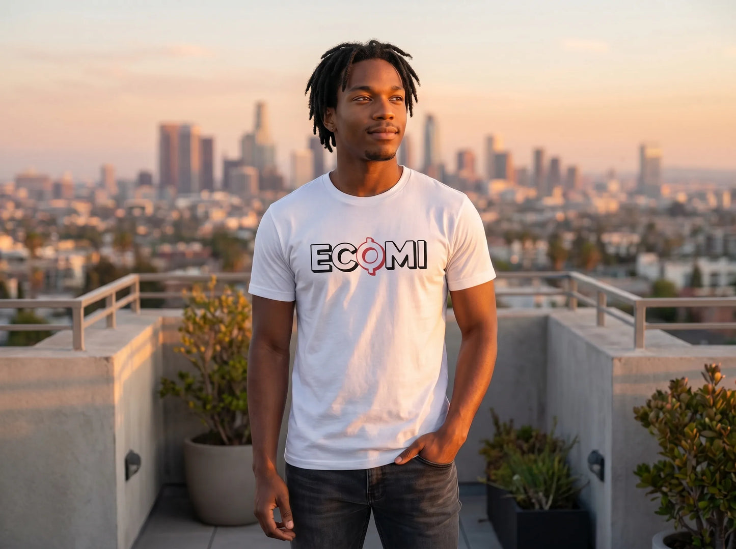Ecomi Text Logo T-Shirt — ECOMI unisex tee in white, modeled at rooftop sunset view