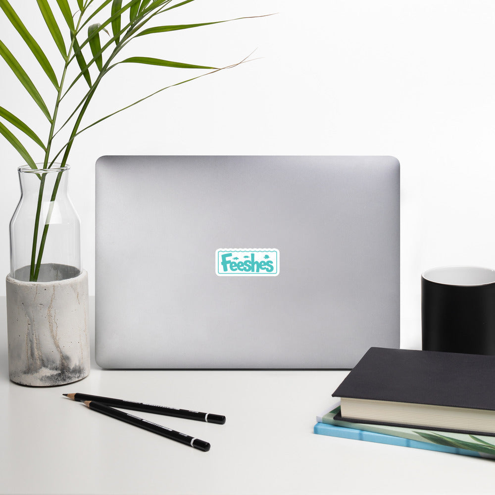 Feeshes Tank Logo sticker on a laptop