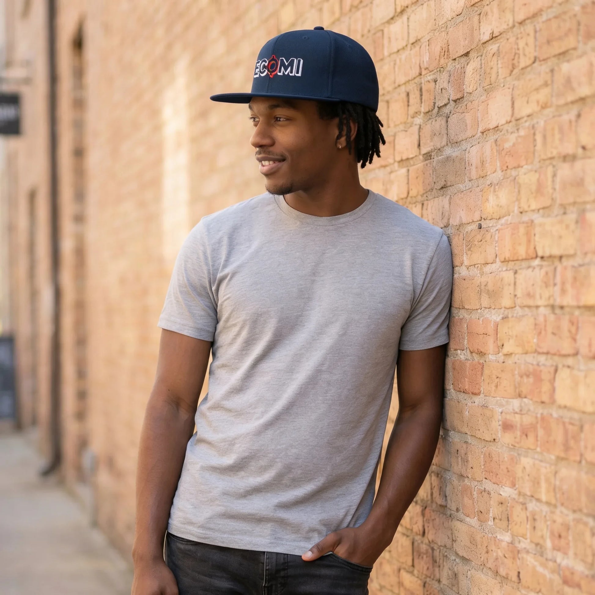 Ecomi Snapback Hat — modeled at urban-day-wall, snapback worn with structured flat bill