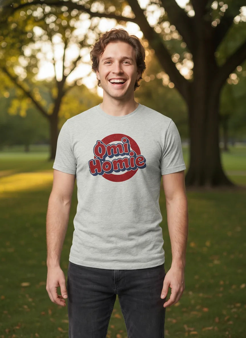 Omi Homie T-Shirt — ECOMI community tee in ash, modeled at sunny park