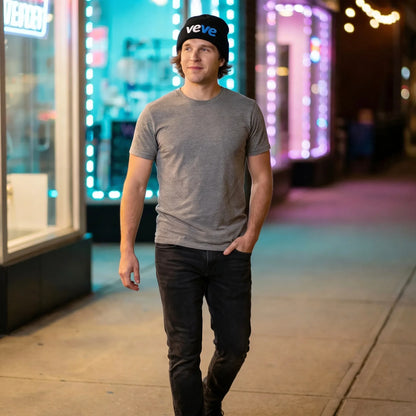 Veve Digital Collectibles Logo Cuffed Beanie — modeled at urban night street, black beanie with veVe embroidery worn naturally