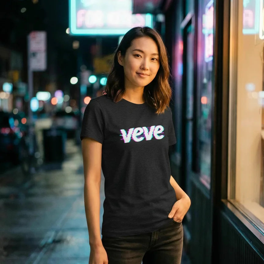 VeVe Logo Glitch T-Shirt — glitch-art collector tee in black, modeled at neon night street
