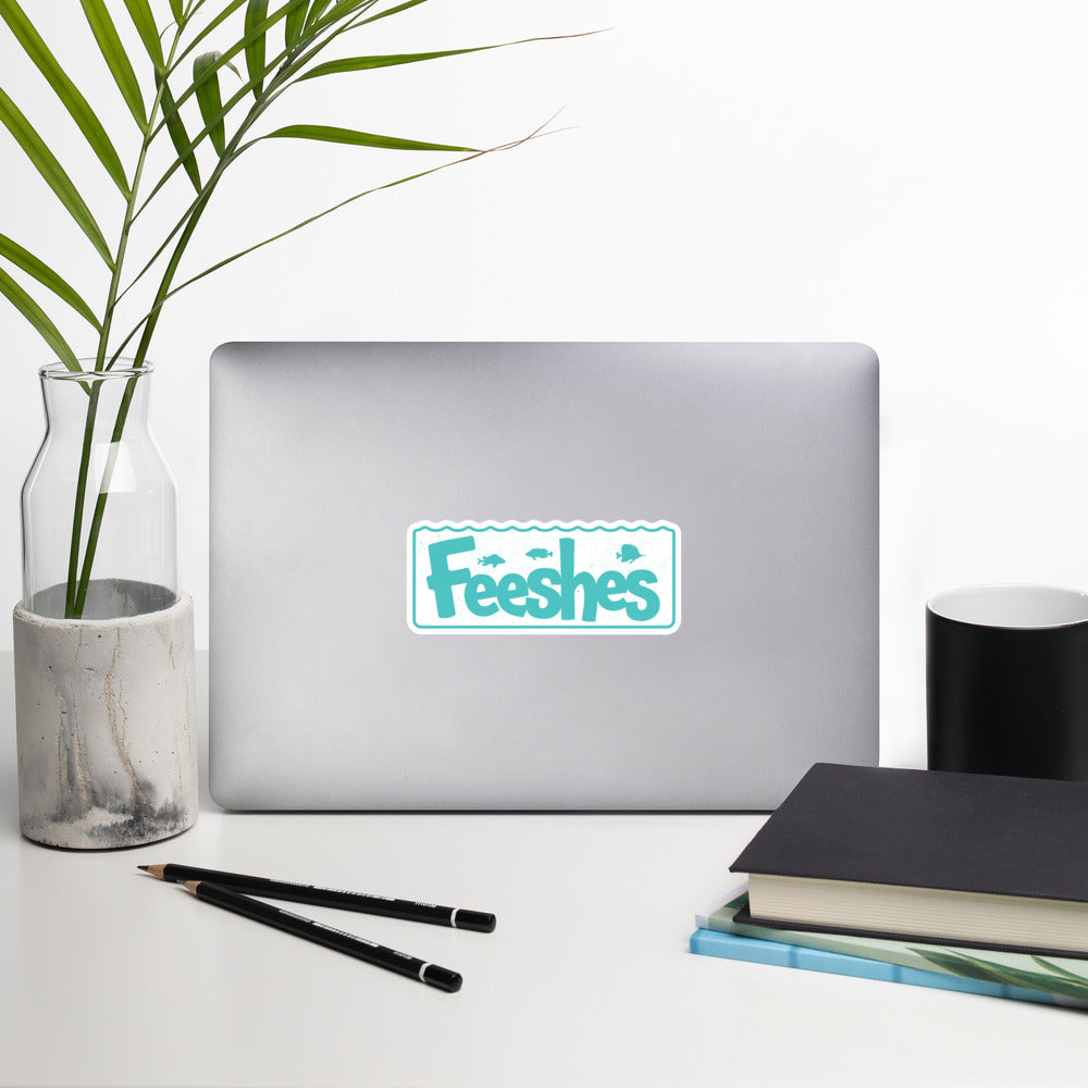 Feeshes Tank Logo sticker on a laptop